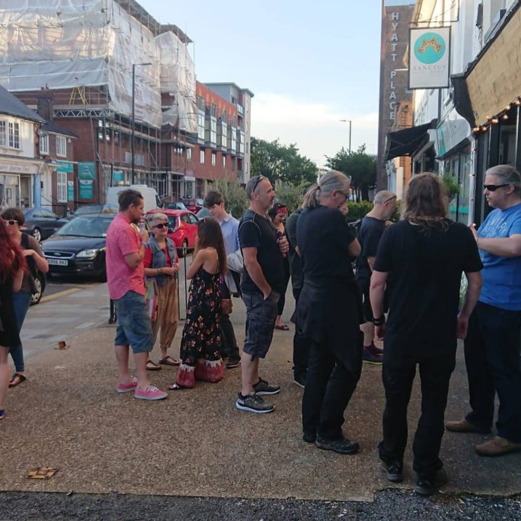 Artists and art lovers gathering at the Window Gallery for the opening night